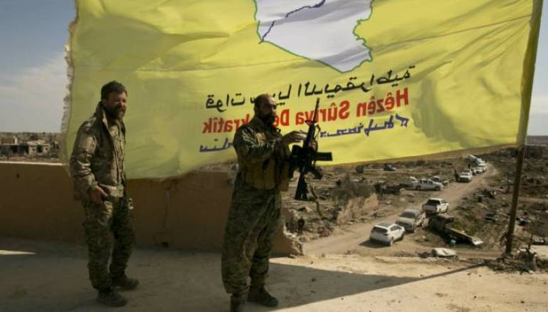 Syrian Kurdish leader says preliminary deal reached to merge forces with Damascus