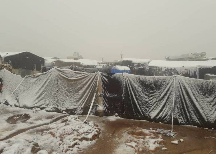 After rainstorm, snow deepens suffering in the northern camps