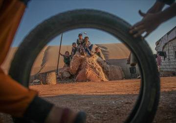 Civilians sheltered in Syrian refugee camps mark Muslim holiday despite difficulties