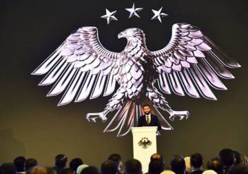 Syrians celebrate the launch of the state's new visual identity
