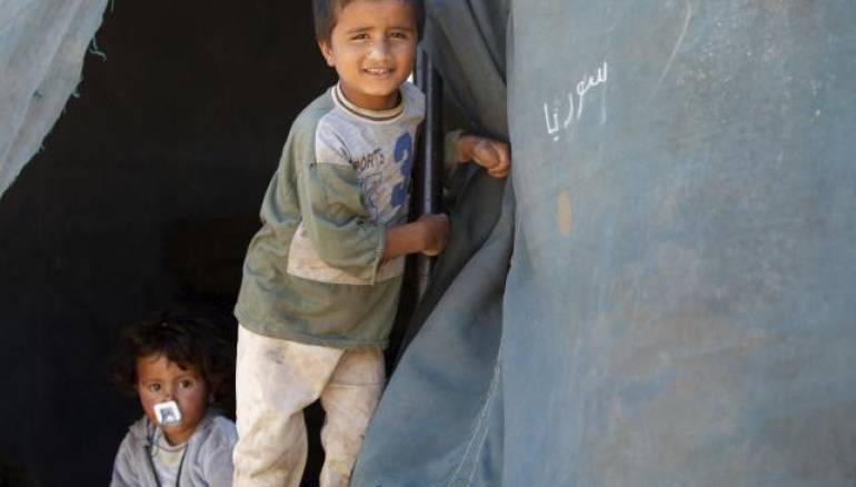  Displaced children, who fled the ancient city of Palmyra after Islamic State fighters took control of the area, stand by their tent in Gazaleh town, north of Homs, Syria June 3, 2015. Reuters/Omar Sanadiki