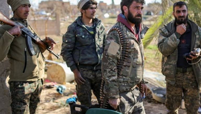 Image result for The Syrian Democratic Forces (SDF) battled Islamic State militants holed up in the Baghouz area overnight, supported by U.S.-led coalition air strikes, the SDF said, seeking to defeat the last pockets of jihadist resistance. The SDF has been battling for weeks to defeat Islamic State at the Baghouz enclave in southeastern Syria at the Iraqi border, all that remained of the territory the militants ruled, which once spanned a third of Syria and Iraq. While the U.S.-backed SDF has captured most of the area, Mustafa Bali, head of the SDF media office, told Reuters SDF fighters were clashing late on Thursday with IS militants in more than two positions where they were refusing to surrender. The jihadists were holed up in what appeared to be caves in a rocky shelf overlooking Baghouz, and in trenches by the nearby Euphrates River, he said. U.S.-led coalition war planes had conducted two raids on Thursday evening against IS movements. âOur forces are trying to force them to surrender, but so far the clashes are continuing,â Bali said. Though the defeat of Islamic State at Baghouz ends its grip over populated territory, the group remains a threat, with fighters operating in remote territory elsewhere and capable of mounting insurgent attacks.